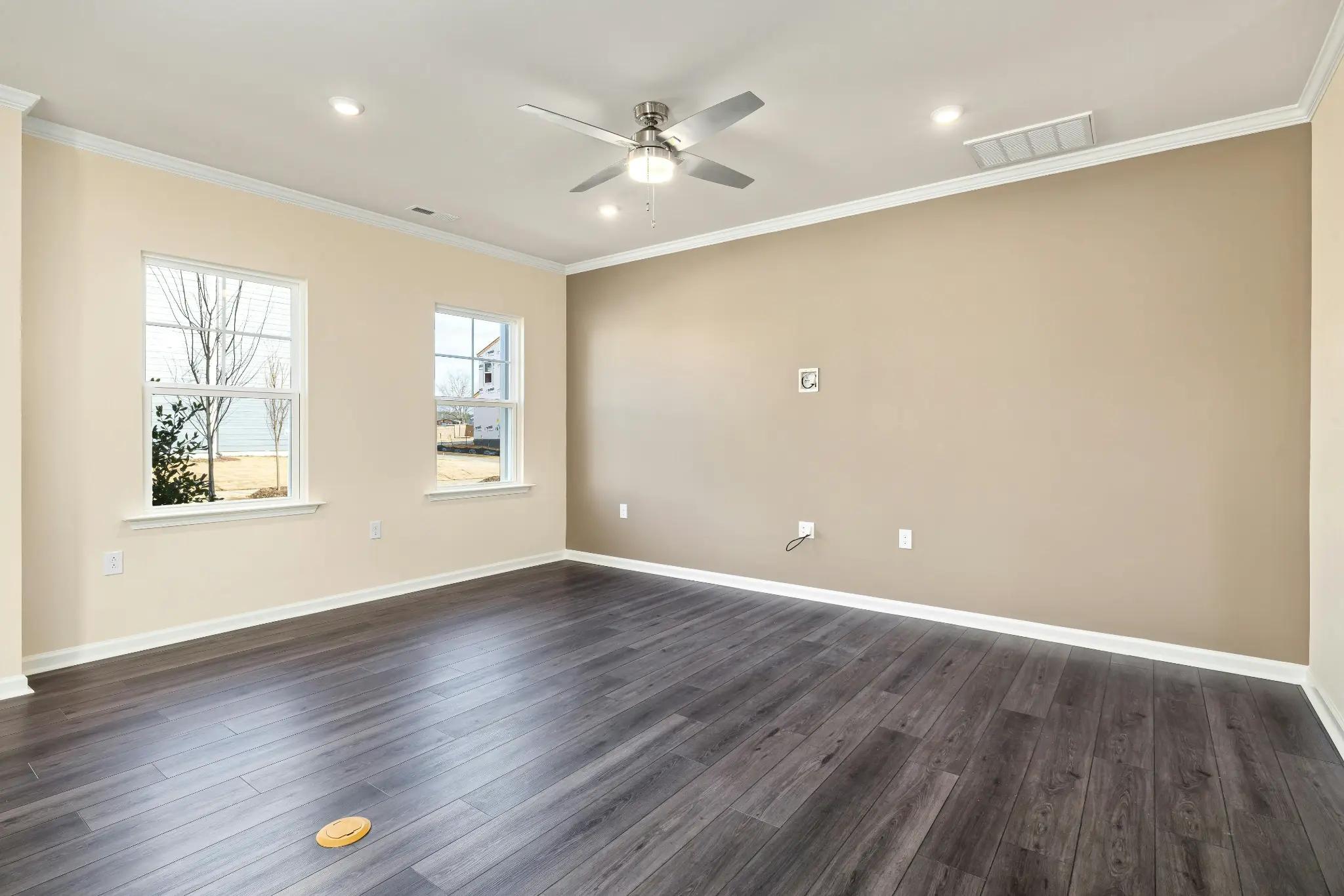 This room features one of the most popular current hardwood floor styles: wide planks in a cool, gray-toned finish.